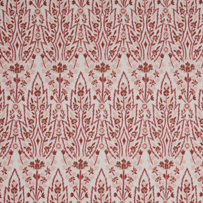 A red and white floral pattern on a white background inspired by Mughal gardens, featuring the Marmar Berry Performance Fabric by John Robshaw.