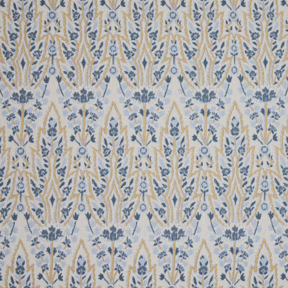A blue and yellow floral pattern on a white background inspired by the Mughal gardens of Shalimar Bagh, featuring the Marmar Marigold Performance Fabric by John Robshaw.