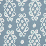 The Palak Decorative Pillow by John Robshaw showcases a hand block printed symmetrical geometric pattern, featuring white diamond shapes and circles interconnected by ornate swirl designs on a high-quality light blue linen/cotton fabric. - 31263350652974