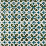 A blue and green floral pattern on a white background that is hand block printed, like the Mizan Peacock Kidney Pillow by John Robshaw. - 30801476223022