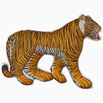 A Tiny Tiger Pillow wooden figurine with beads on a white background. (brand: John Robshaw) - 30404862476334