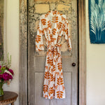 A Amar Robe by John Robshaw hanging on an old wooden door. - 30437793136686