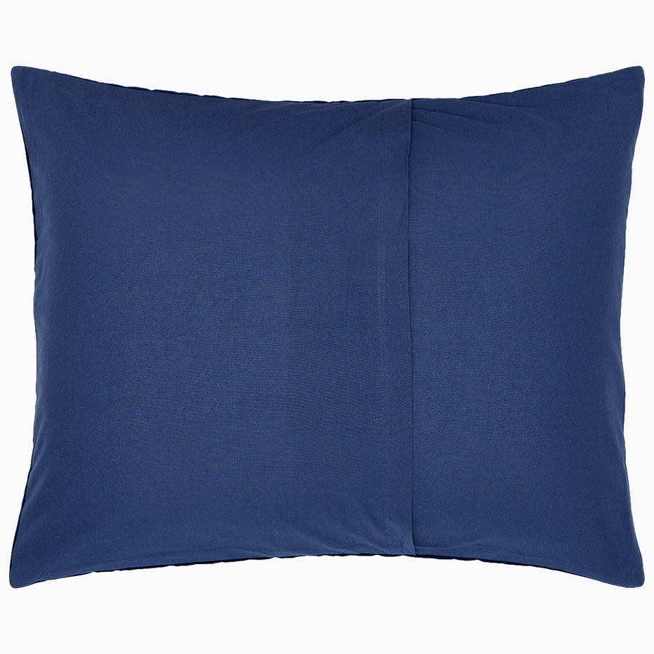 A hand-quilted Velvet Indigo Quilt pillow with a pocket, crafted by Indian artisans using velvet fabric, made by John Robshaw.