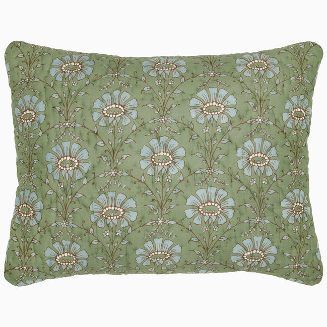 The Jeeva Sage Quilt by John Robshaw is a rectangular pillow with a green background, featuring a pattern of large blue and white flowers with intricate stems and leaves, reminiscent of a spring meadow design. This soft cotton quilted piece is both charming and cozy.