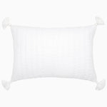 The Velvet White Kidney Pillow by John Robshaw is a rectangular white pillow featuring a quilted pattern, decorative tassels on each corner, and a hidden zipper closure for a seamless finish. - 31272651620398