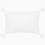 The John Robshaw Velvet White Kidney Pillow showcases a sophisticated design with tassels adorning each of its four corners and a discreet hidden zipper closure, all set against a plain background. - 31272651653166