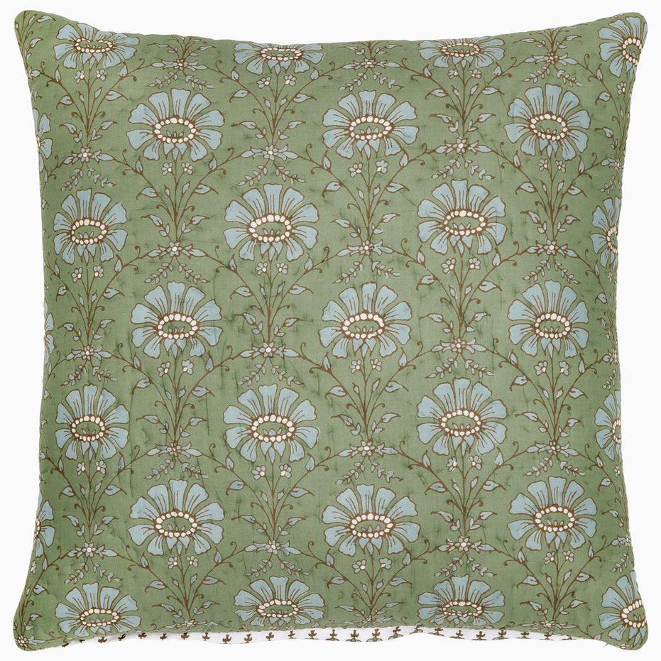 The Jeeva Sage Quilt by John Robshaw is a square throw pillow with a light green background showcasing a spring meadow design of white and light blue flowers with brown stems and leaves, all hand quilted from soft cotton.