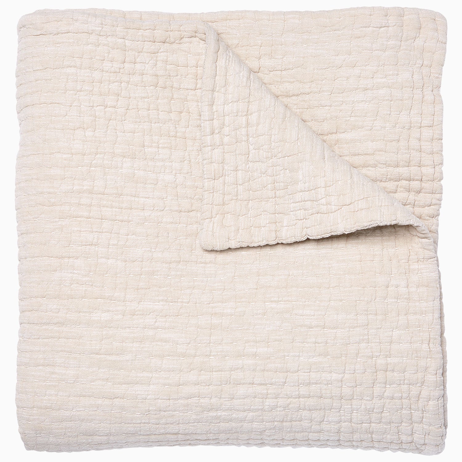 A Vivada Sand Woven Quilt, hand-stitched quilt, on a white background by John Robshaw.