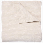 A Vivada Sand Woven Quilt, hand-stitched quilt, on a white background by John Robshaw. - 30252474138670