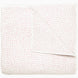 A white and pink Organic Hand Stitched Lotus Quilt with dots, by John Robshaw.