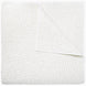 A white cotton voile coverlet featuring John Robshaw's Organic Hand Stitched Sand Quilt with subtle white dot patterns.