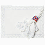 A John Robshaw Stitched Light Indigo Napkins (Set of 4) with a blue and red pattern on it in a formal style. - 29333302181934