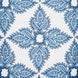 A Maira Indigo Outdoor Decorative Pillow by John Robshaw, with a blue and white paisley pattern on a white background, suitable for outdoor use.
