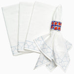 A set of John Robshaw's Stitched Light Indigo Napkins (Set of 4), hand stitched, with a blue ring accent, perfect for adding a touch of formal style to any table setting. - 29333302935598