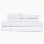 A stack of Stitched Sand Organic Sheets with a bold new look on a white background by Sheets & Cases. - 29299685097518