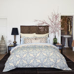 A bedroom with a John Robshaw Bamana Sand Decorative Pillow. - 29302894788654