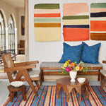A vintage living room with John Robshaw's Large Box Chair in Bindi Clay and colorful furniture. - 29588818821166