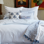 A John Robshaw duvet bed with blue and white Ramra Light Indigo Organic Duvet bedding. - 15617570832430