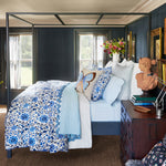 A bedroom with blue walls and a Zoya Azure Organic Duvet made by John Robshaw. - 30002975309870