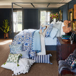 A bed with hand stitched edging and blue and white accents, the John Robshaw Atulya Light Indigo Euro. - 30008983289902