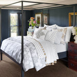 A four poster bed in a bedroom, featuring a John Robshaw Kajal Gray Organic Duvet. - 30002972459054