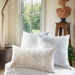 Three Nisha Euro pillows with hidden zippers arranged on a bed in front of a window. - 30009697730606