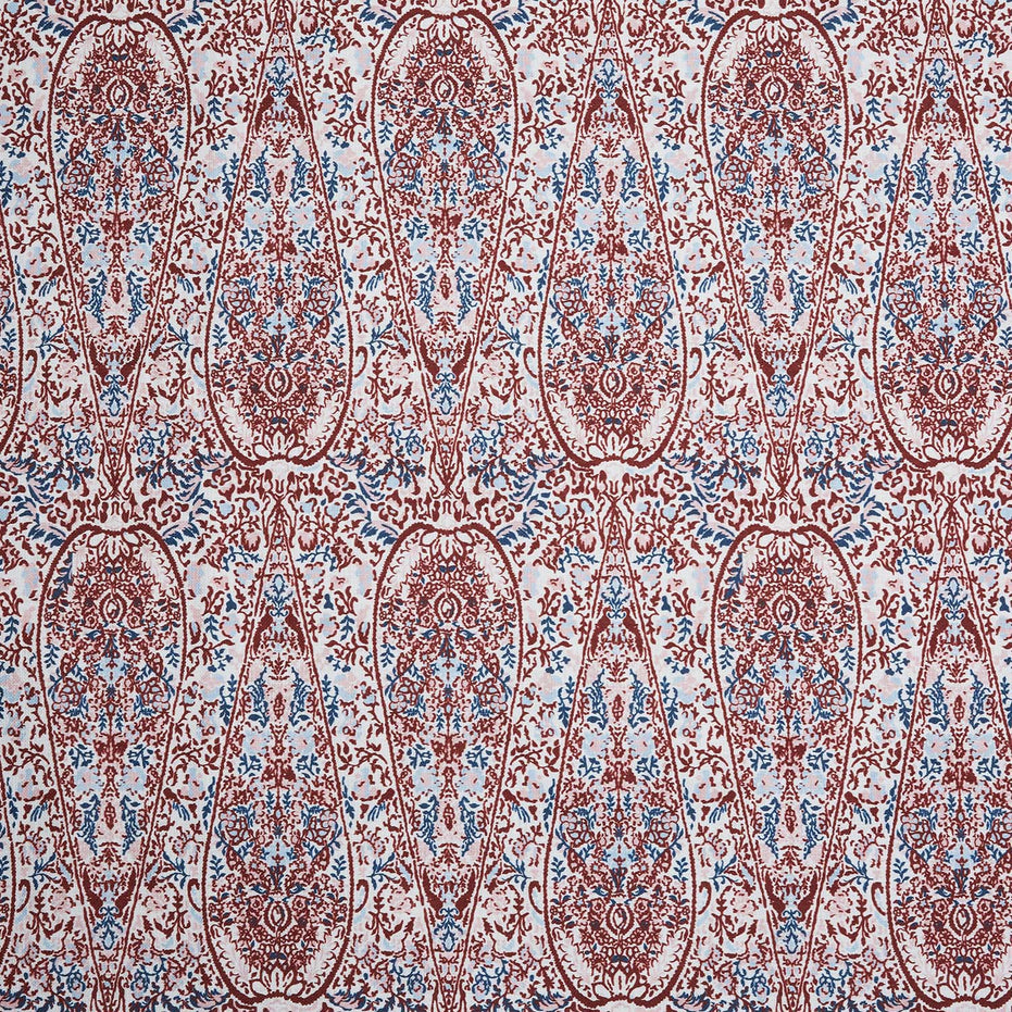 A John Robshaw Ishya Teak Fabric with a red and blue paisley print.