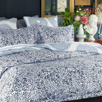 A bed with a Ira Indigo Organic Duvet made of organic cotton by John Robshaw. - 30002969444398