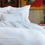 An organic cotton bed with the Ramra Light Indigo Organic Sheets from the brand Sheets & Cases. - 30270324736046