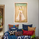 A vintage-inspired living room with a Princess With Faded Blue Sky Tapestry by John Robshaw hanging above a couch.