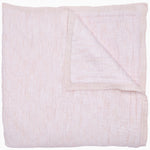 A Sagana Lotus Quilt folded on top of a white background, perfect for snuggling. - 29576180826158