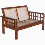 A Vintage Furniture Loveseat With Grid Arms with a rattan seat. - 29225296461870