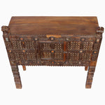 A John Robshaw Wooden Carved Manjoo Skinny table with intricate carvings. - 28341630795822