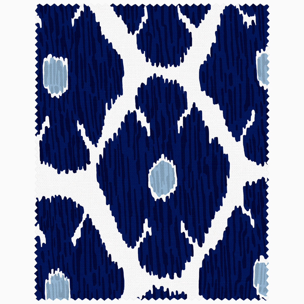 A John Robshaw swatch featuring a blue and white ikat pattern on a white background.