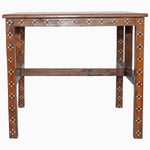 A John Robshaw wooden inlay table with studded legs. - 30273406435374