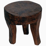 A Teak Wooden Stool 6 with a round top, inspired by the Antique Naga tribal stools from Nagaland has been created by John Robshaw. - 30276475748398