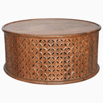 A John Robshaw Round Wooden Jali Table with intricately carved sides. - 30280699183150