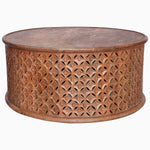 An intricately carved Round Wooden Jali Table with a round shape, featuring a diamond motif on the sides by John Robshaw. - 30280699248686