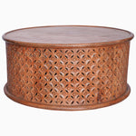 A Round Wooden Jali Table with intricately carved sides by John Robshaw. - 30280699117614