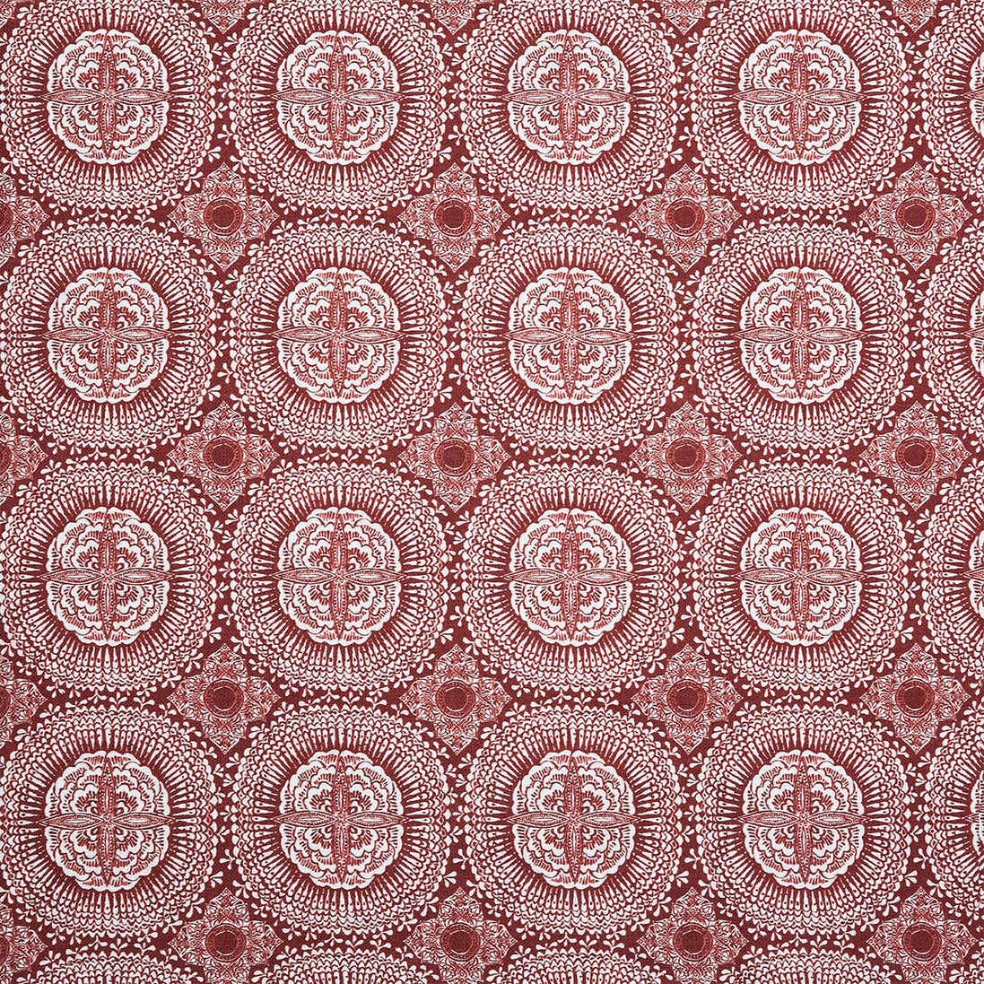A red and white block print pattern on Kala Teak fabric by John Robshaw.