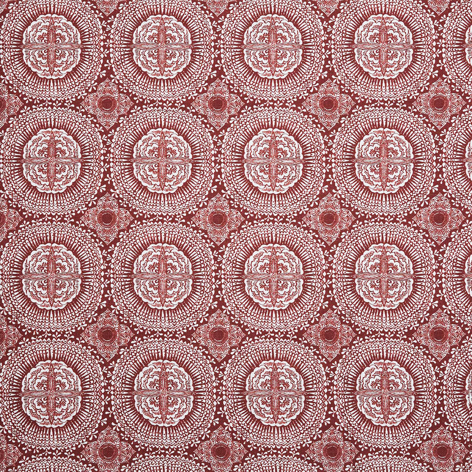 A red and white block print pattern on Kala Teak fabric by John Robshaw.
