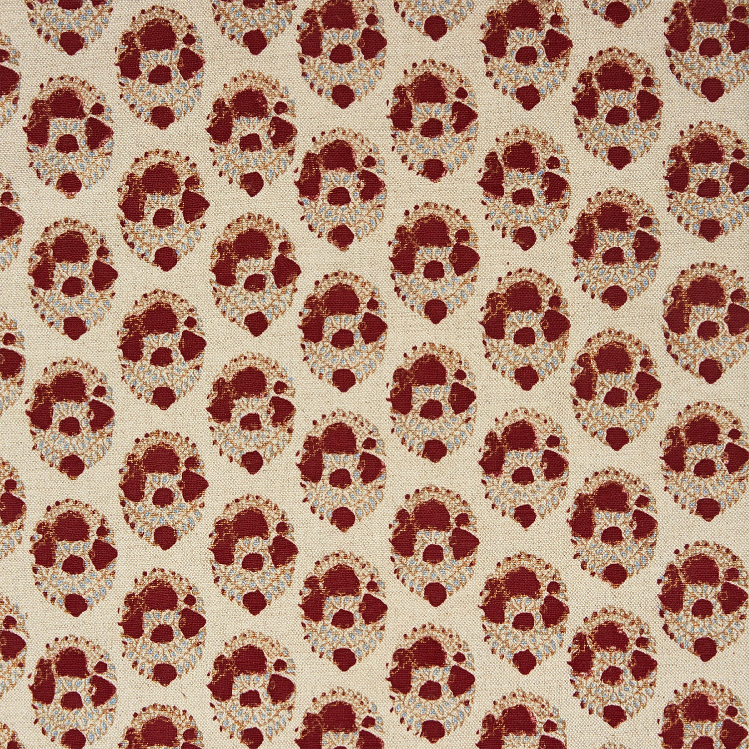 A red and beige floral pattern on a white background, created using traditional craftsmanship using the Kukkuta Teak Fabric by John Robshaw.