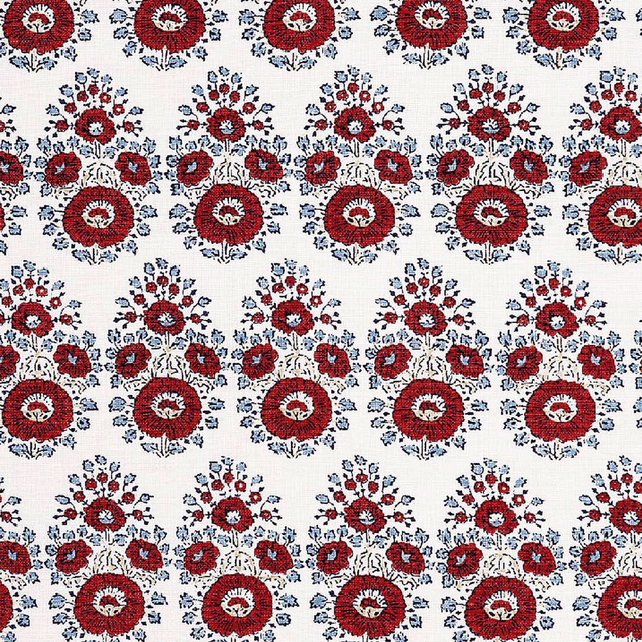A hand block printed Lanka Coral Fabric with a red and blue paisley pattern on a white background, showcasing traditional craftsmanship, from the brand John Robshaw.