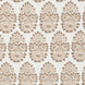 A beige and brown paisley pattern on a white background, featuring block prints is showcased on the Lanka Sand Performance Fabric by John Robshaw.