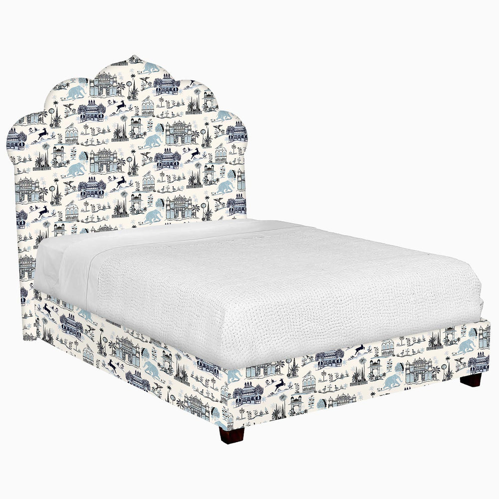 A John Robshaw Custom Bihar Bed with a blue and white pattern fabric.