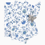 A Vakula Periwinkle Napkins (Set of 4) by John Robshaw, hand printed blue and white floral napkin with a butterfly on it. - 29999009038382