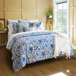 A cozy bedroom with a Zoya Azure Organic Duvet by John Robshaw and a blue and white floral comforter with a 200 thread count. - 30042841317422