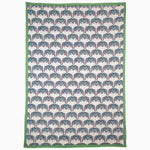An embroidered Peacock Party Suzani tea towel inspired by Central Asian suzanis, featuring blue and green colors with charming elephants adorning it, created by John Robshaw. - 30265251659822