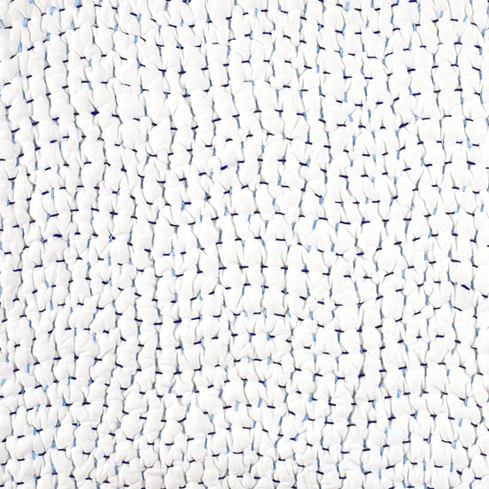 A close up of a John Robshaw Organic Hand Stitched Light Indigo Quilt Swatch.