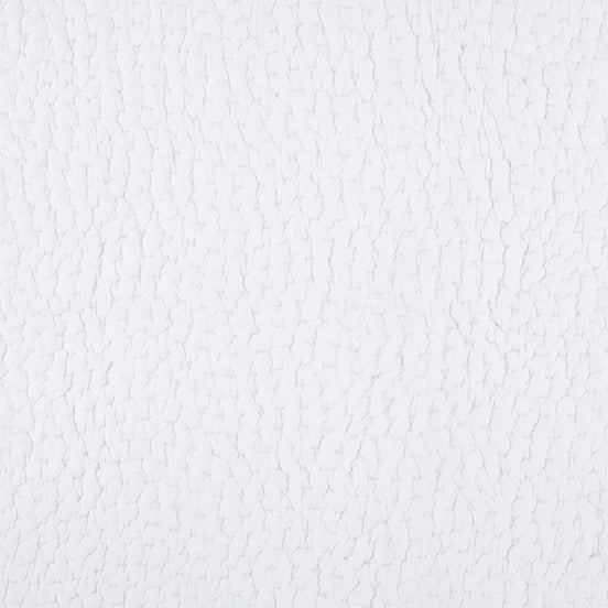 A close up image of a John Robshaw Organic Hand Stitched White Quilt Swatch with hand stitching.